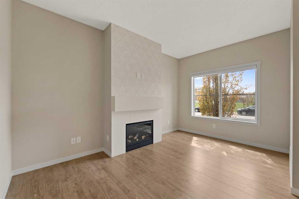 81 Copperpond Landing Se, Calgary, AB - Indoor Photo Showing Living Room With Fireplace