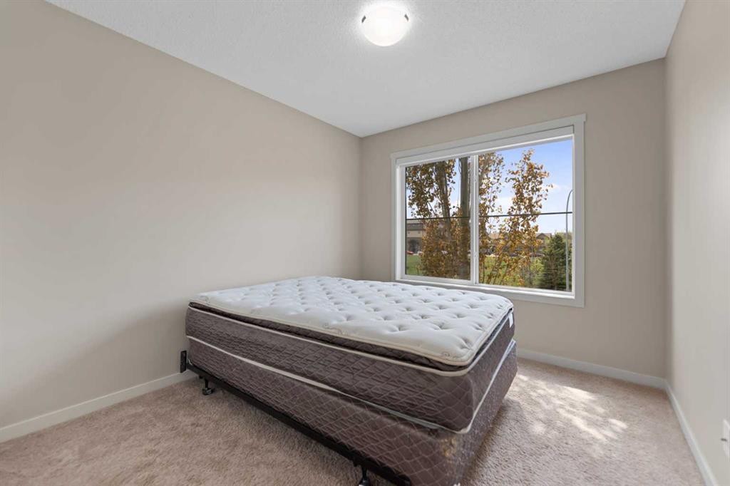 81 Copperpond Landing Se, Calgary, AB - Indoor Photo Showing Bedroom