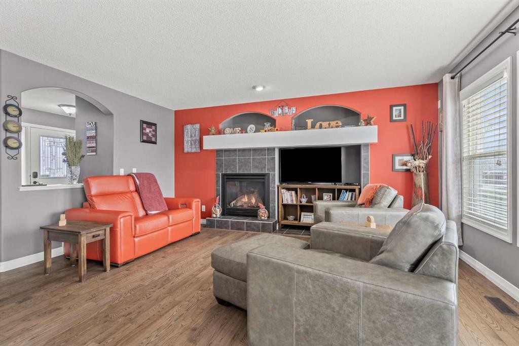 715 Copperpond Circle Se, Calgary, AB - Indoor Photo Showing Living Room With Fireplace