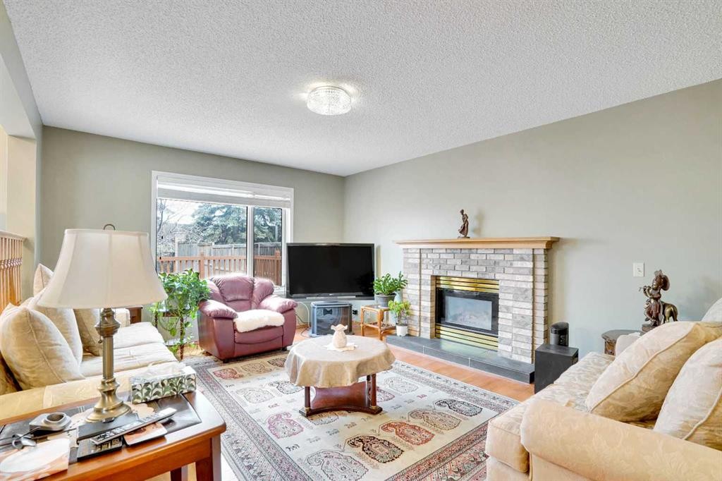 60 Douglas Woods Terrace Se, Calgary, AB - Indoor Photo Showing Living Room With Fireplace