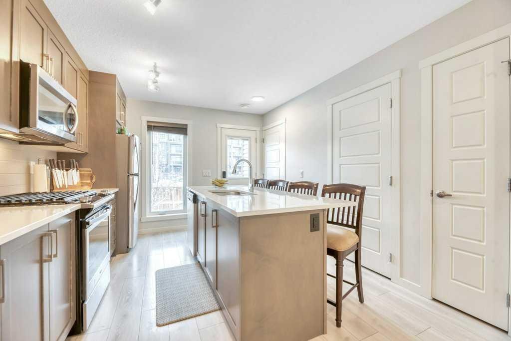 413-338 Seton Circle Se, Calgary, AB - Indoor Photo Showing Kitchen With Upgraded Kitchen