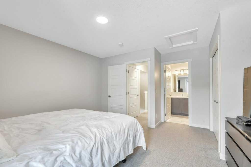 413-338 Seton Circle Se, Calgary, AB - Indoor Photo Showing Bedroom
