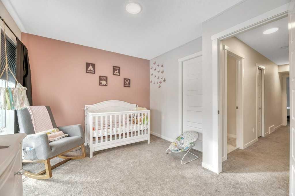 413-338 Seton Circle Se, Calgary, AB - Indoor Photo Showing Bedroom