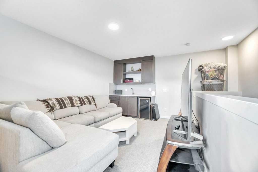 413-338 Seton Circle Se, Calgary, AB - Indoor Photo Showing Living Room