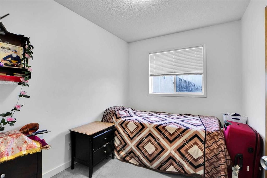 63 Martinbrook Road Ne, Calgary, AB - Indoor Photo Showing Bedroom
