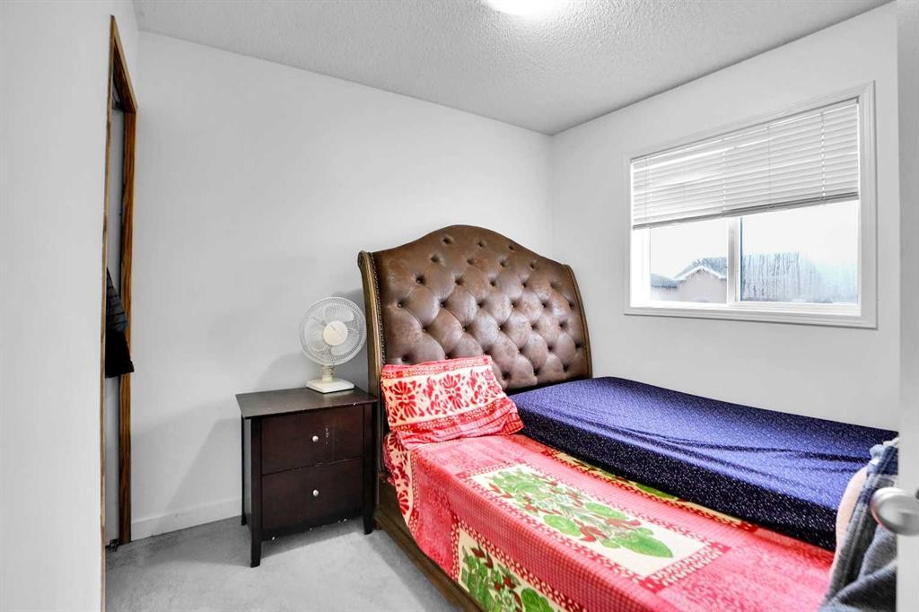 63 Martinbrook Road Ne, Calgary, AB - Indoor Photo Showing Bedroom