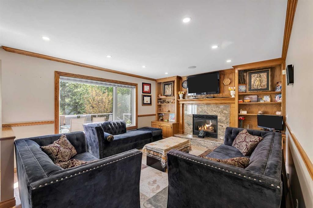 33 Edgevalley Way Nw, Calgary, AB - Indoor Photo Showing Living Room With Fireplace