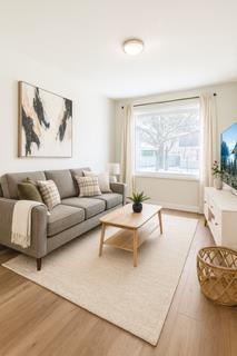 7634 24A Street Se, Calgary, AB - Indoor Photo Showing Living Room
