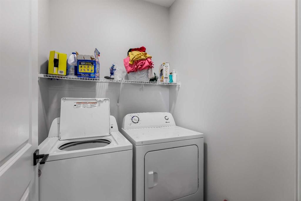 15 Edith Passage Nw, Calgary, AB - Indoor Photo Showing Laundry Room