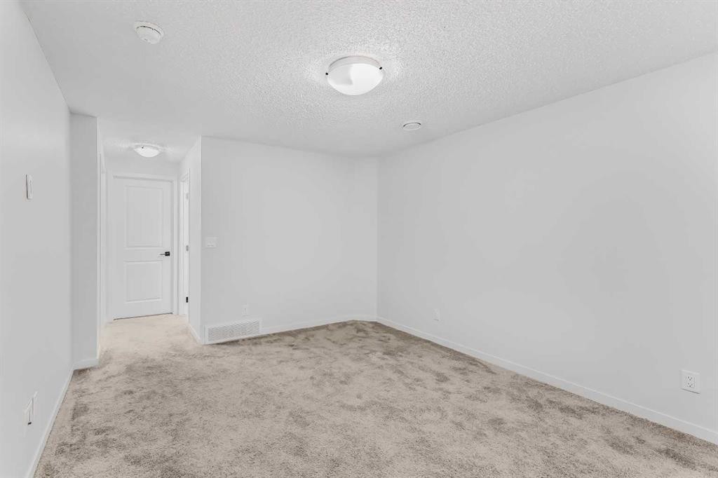 15 Edith Passage Nw, Calgary, AB - Indoor Photo Showing Other Room