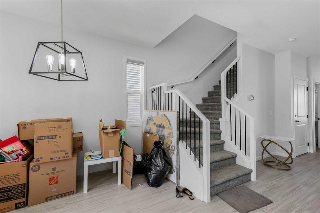 15 Edith Passage Nw, Calgary, AB - Indoor Photo Showing Other Room