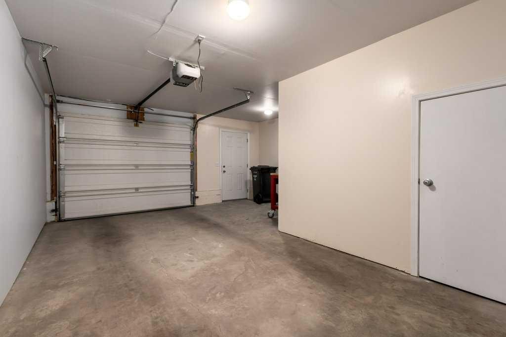 1102 Prairie Sound Circle Nw, High River, AB - Indoor Photo Showing Garage