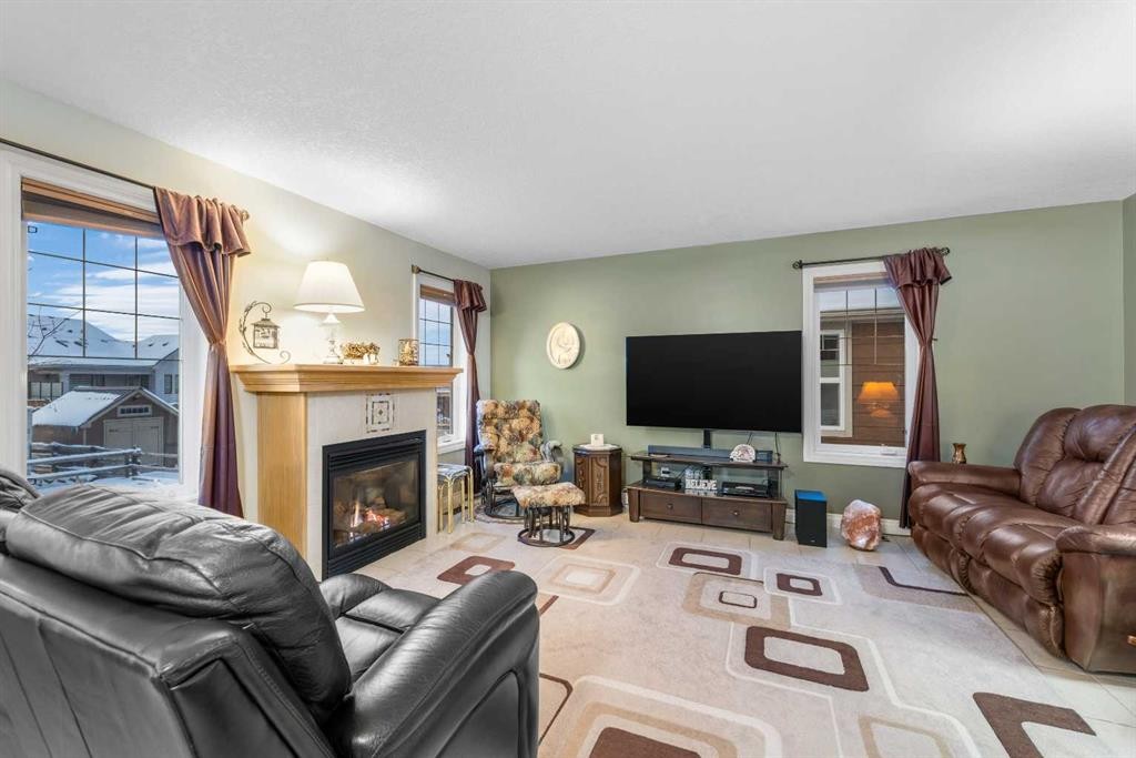 541 Highwood Drive, Longview, AB - Indoor Photo Showing Living Room With Fireplace