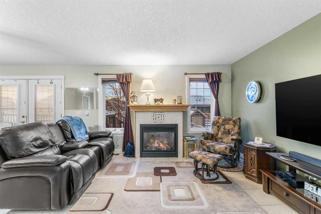 541 Highwood Drive, Longview, AB - Indoor Photo Showing Living Room With Fireplace