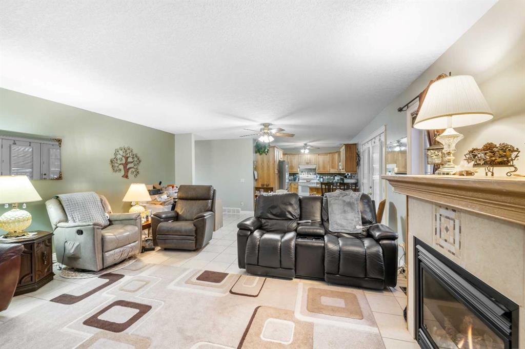 541 Highwood Drive, Longview, AB - Indoor Photo Showing Living Room With Fireplace