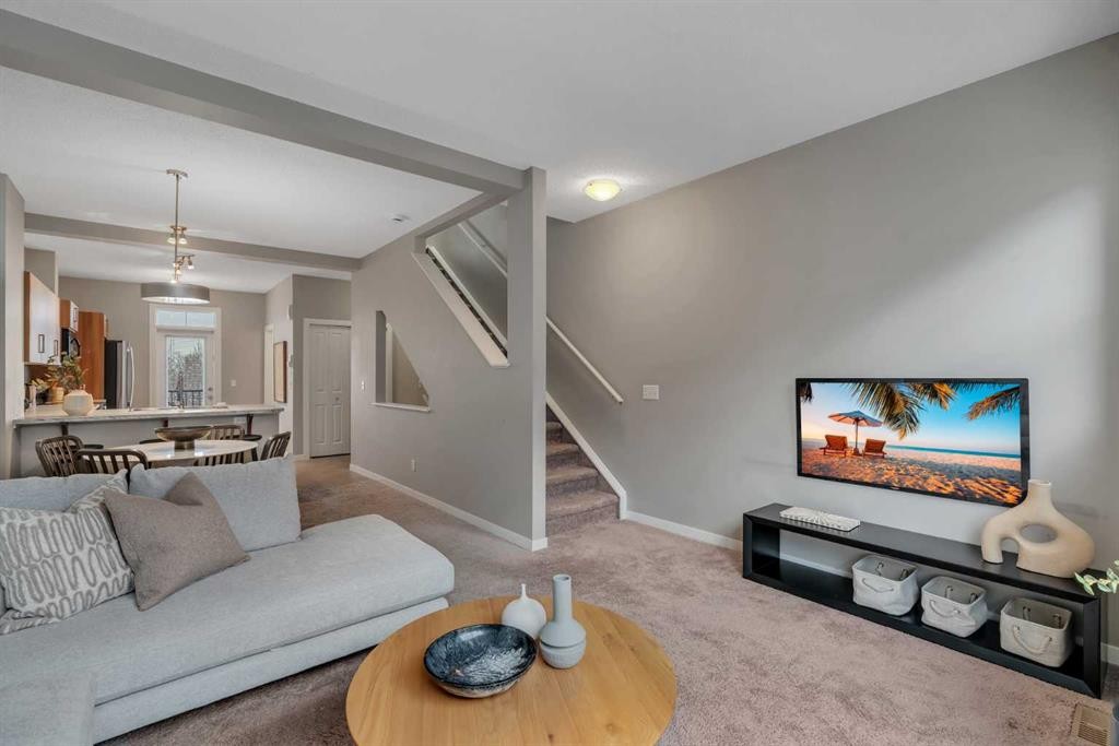 34 New Brighton Point Se, Calgary, AB - Indoor Photo Showing Living Room
