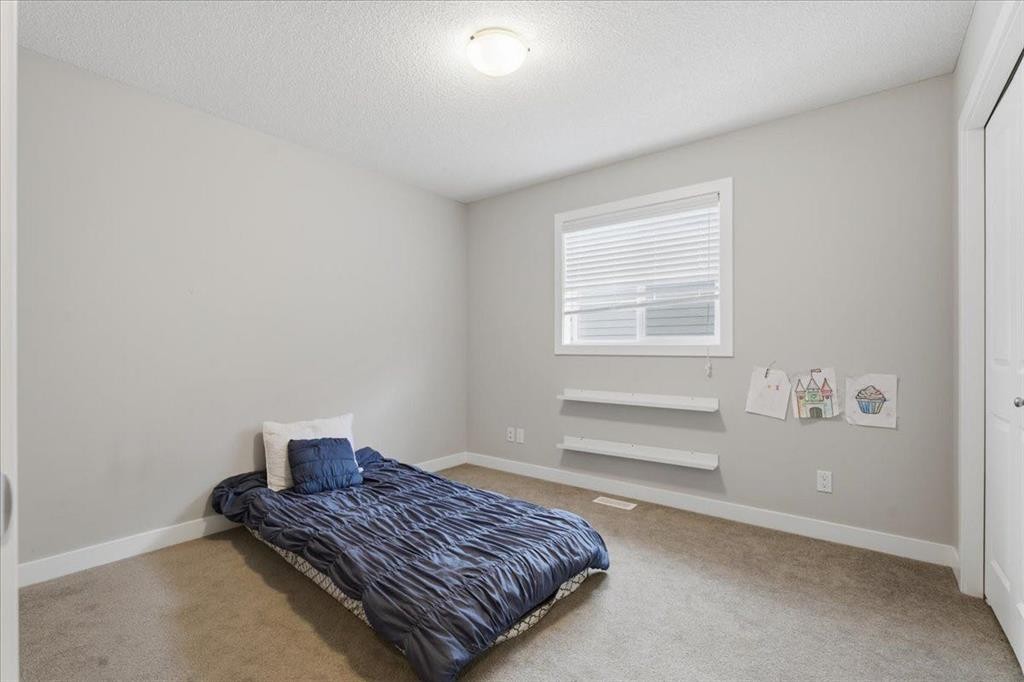 52 Brightoncrest Terrace Se, Calgary, AB - Indoor Photo Showing Bedroom