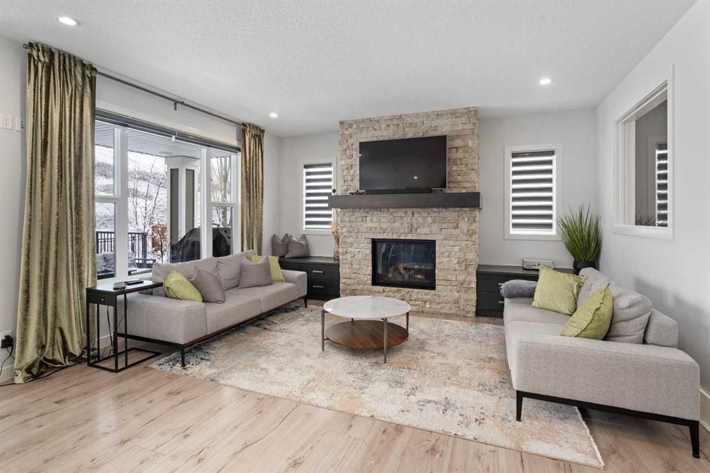 81 Cranbrook Place Se, Calgary, AB - Indoor Photo Showing Living Room With Fireplace
