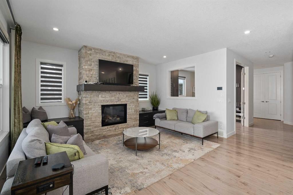81 Cranbrook Place Se, Calgary, AB - Indoor Photo Showing Living Room With Fireplace