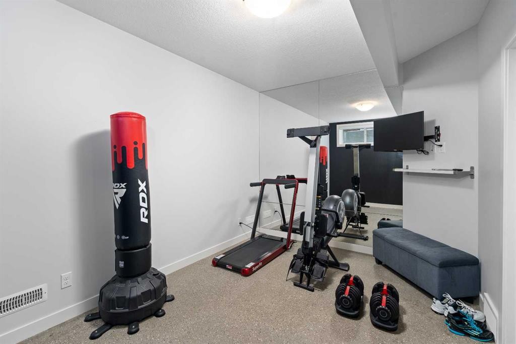 81 Cranbrook Place Se, Calgary, AB - Indoor Photo Showing Gym Room