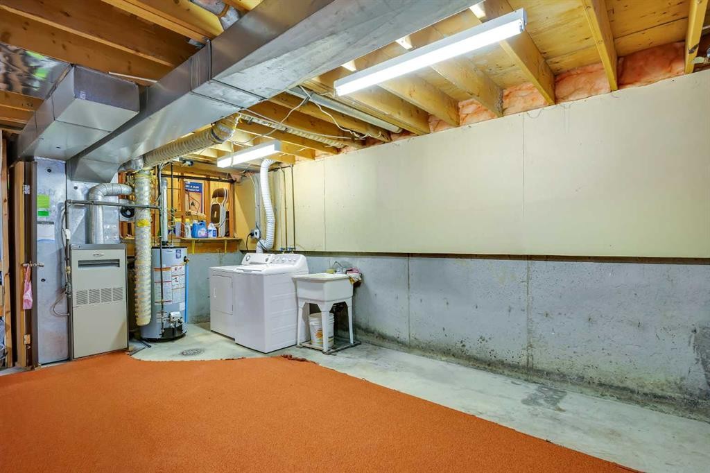 12 Whitaker Close Ne, Calgary, AB - Indoor Photo Showing Laundry Room