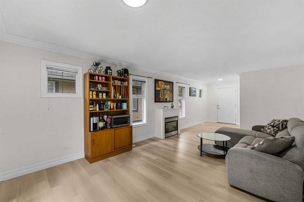 27 Cedarwood Lane Sw, Calgary, AB - Indoor Photo Showing Living Room With Fireplace