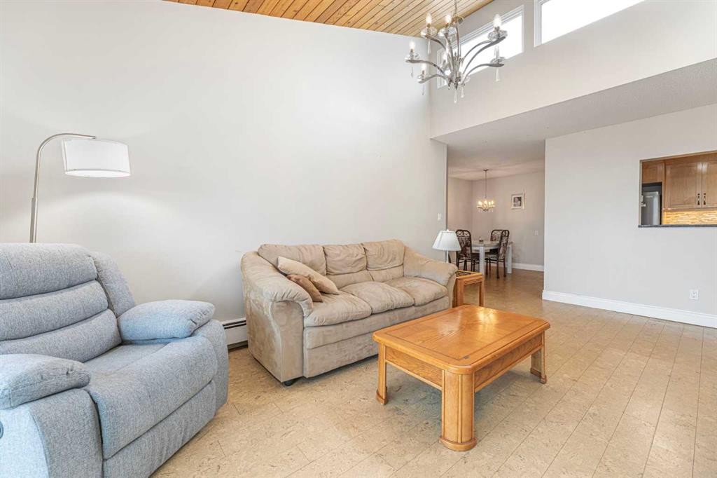 410-3730 50 Street Nw, Calgary, AB - Indoor Photo Showing Living Room