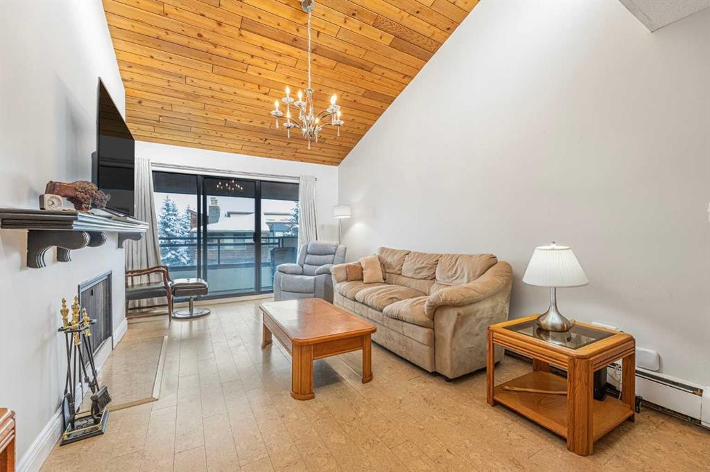 410-3730 50 Street Nw, Calgary, AB - Indoor Photo Showing Living Room With Fireplace