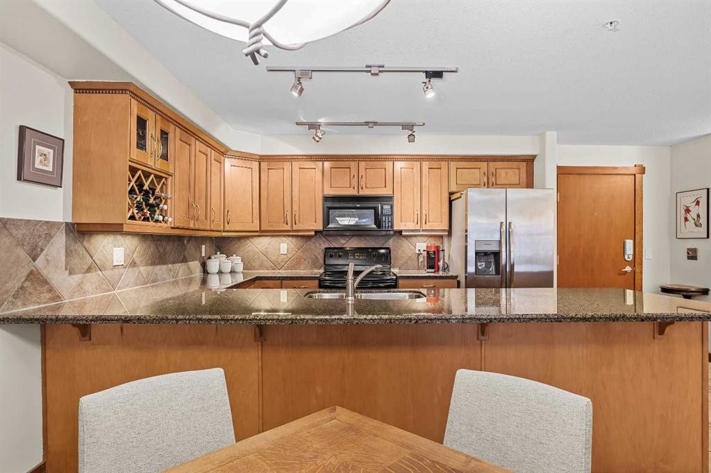 112-150 Crosbow Place, Canmore, AB - Indoor Photo Showing Kitchen With Double Sink