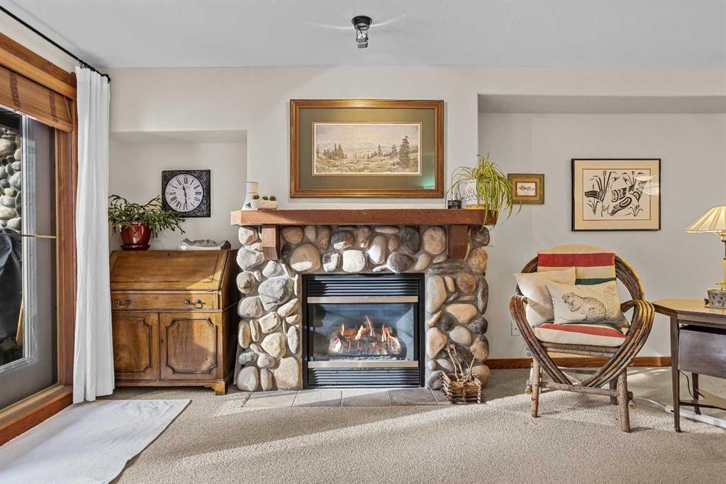 112-150 Crosbow Place, Canmore, AB - Indoor Photo Showing Living Room With Fireplace