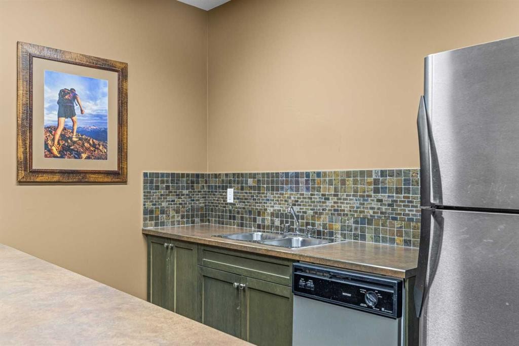 112-150 Crosbow Place, Canmore, AB - Indoor Photo Showing Kitchen With Double Sink