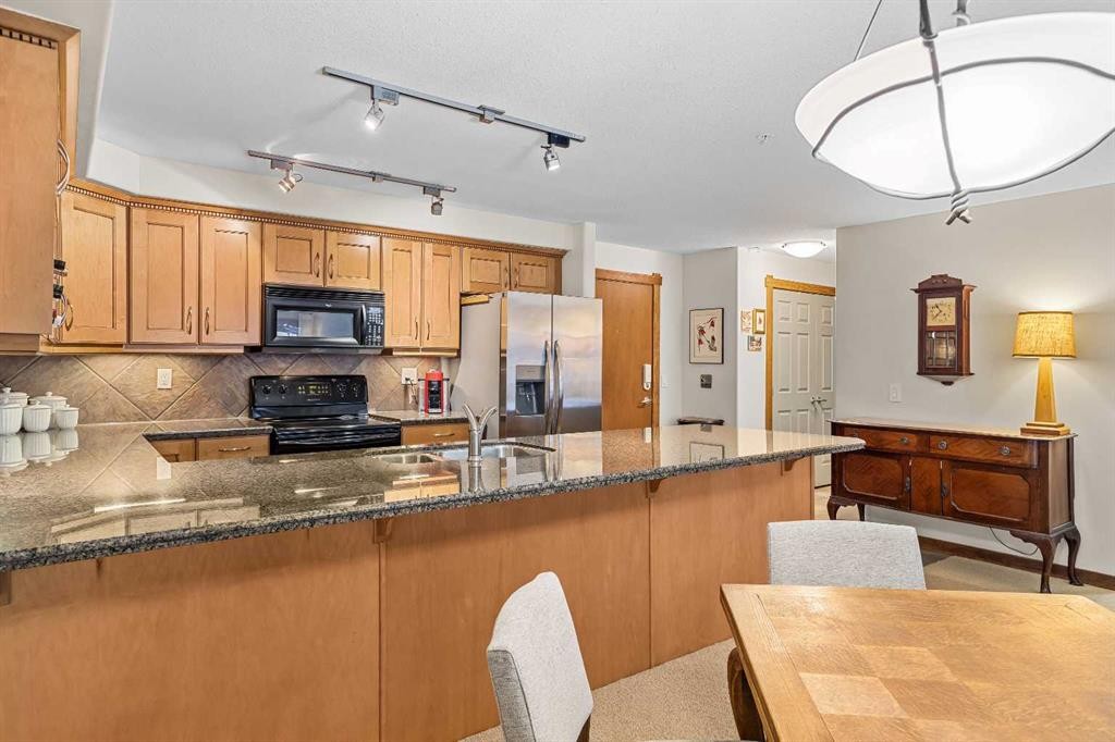 112-150 Crosbow Place, Canmore, AB - Indoor Photo Showing Kitchen With Double Sink