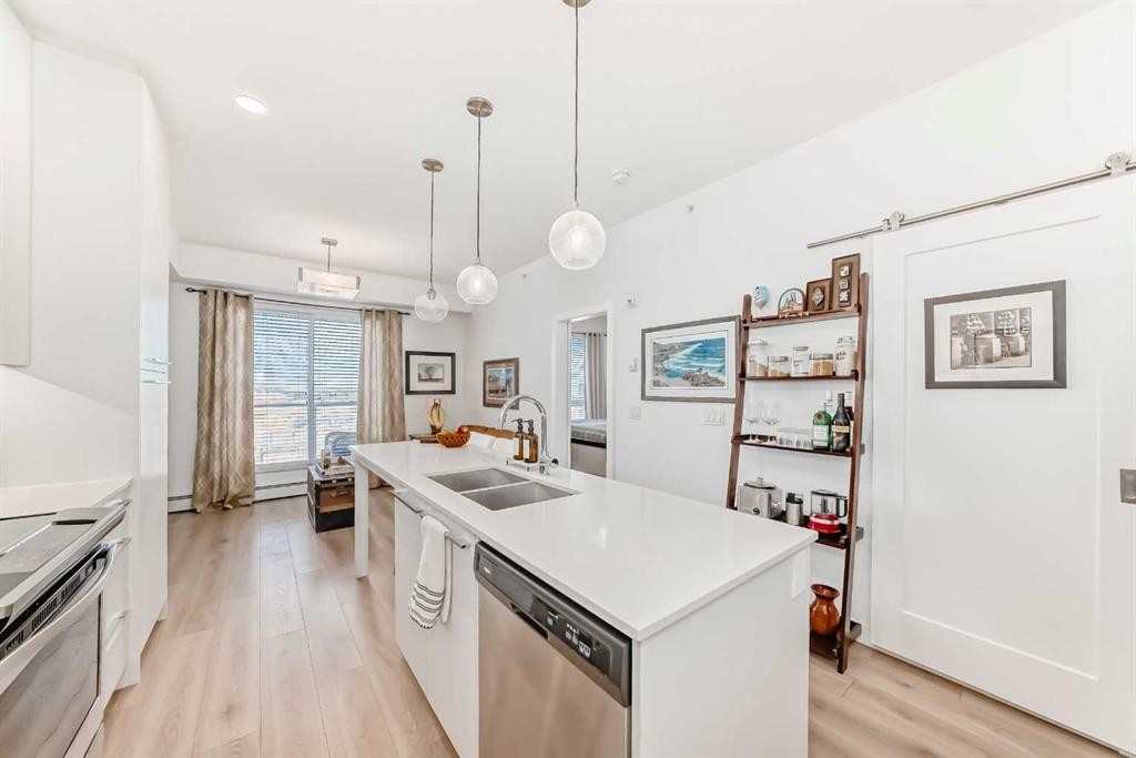 1406-76 Cornerstone Passage Ne, Calgary, AB - Indoor Photo Showing Kitchen With Double Sink With Upgraded Kitchen