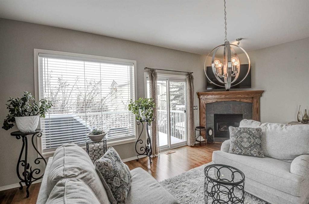 96 Hampstead Green Nw, Calgary, AB - Indoor Photo Showing Living Room With Fireplace