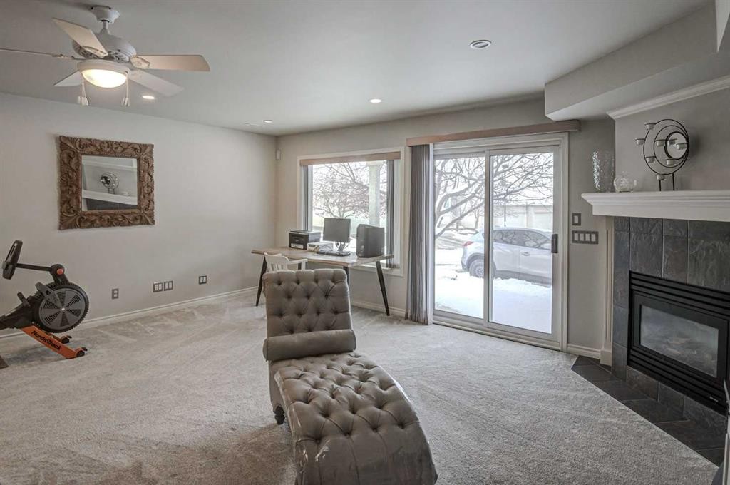 96 Hampstead Green Nw, Calgary, AB - Indoor Photo Showing Living Room With Fireplace