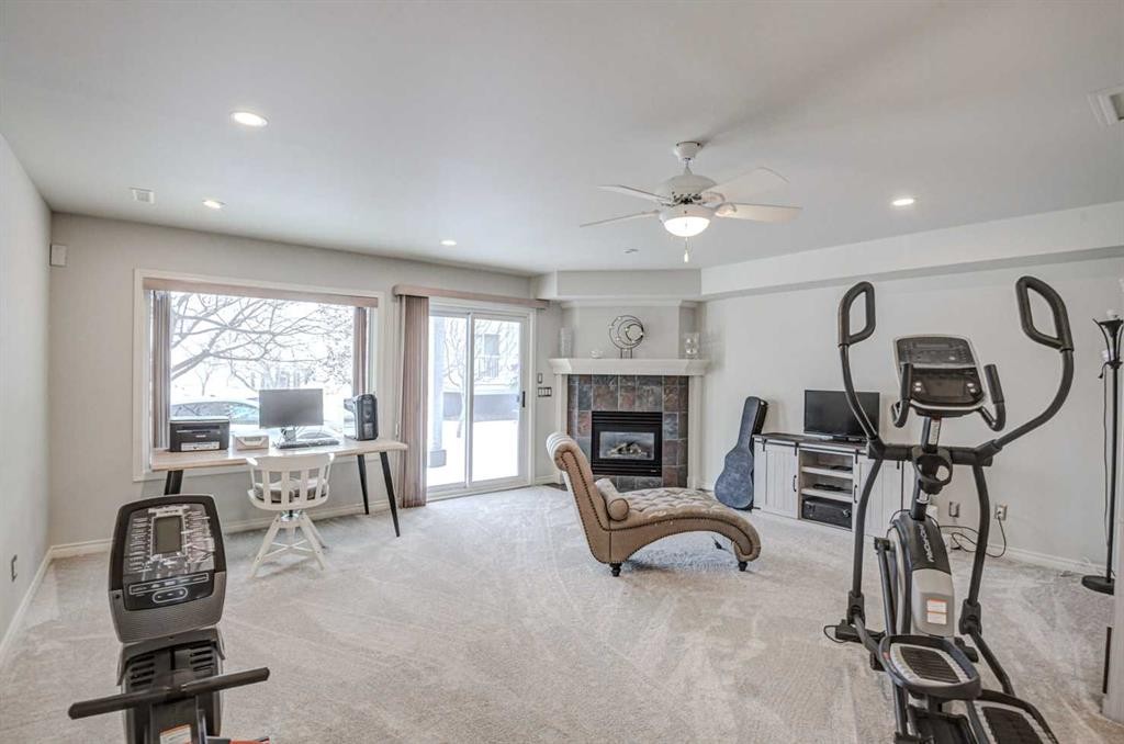 96 Hampstead Green Nw, Calgary, AB - Indoor Photo Showing Other Room With Fireplace