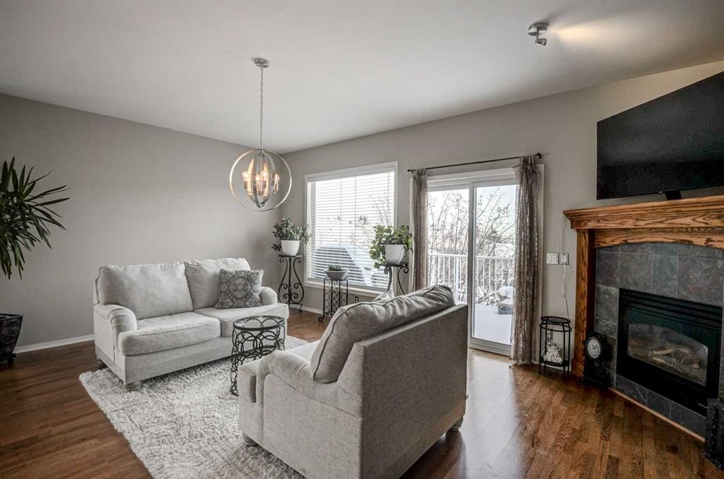 96 Hampstead Green Nw, Calgary, AB - Indoor Photo Showing Living Room With Fireplace