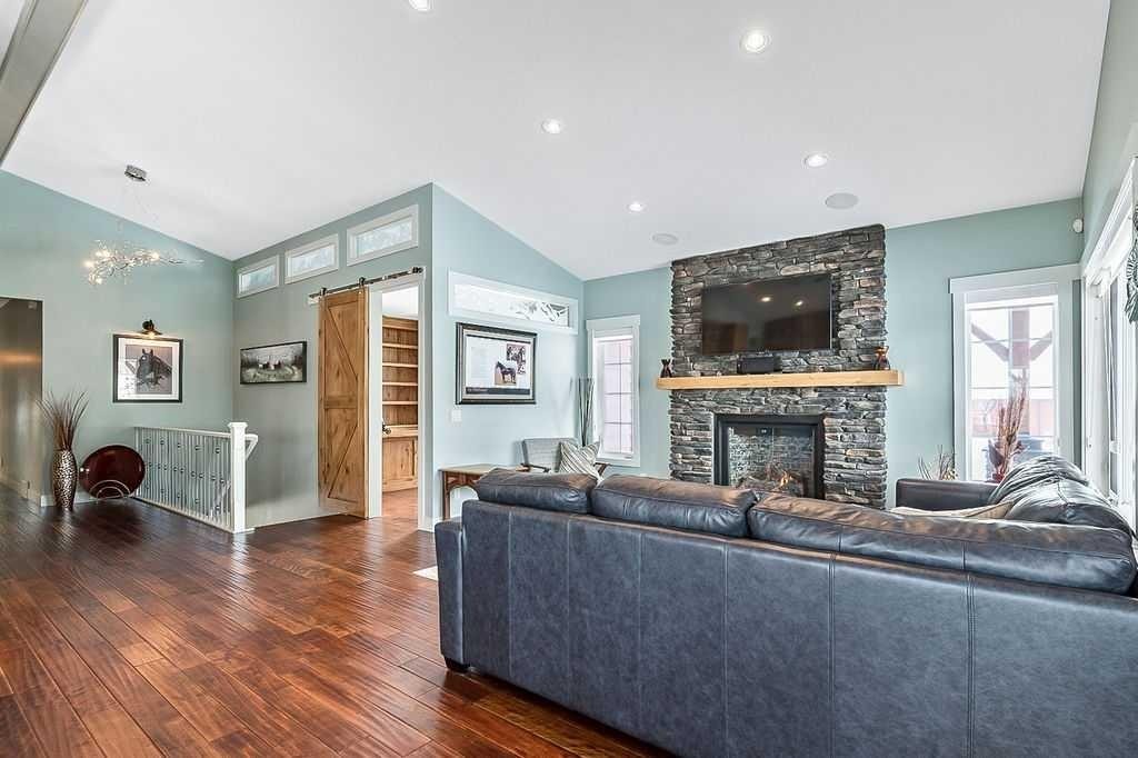 349035 Tamarack Drive East, Rural Foothills County, AB - Indoor Photo Showing Living Room With Fireplace