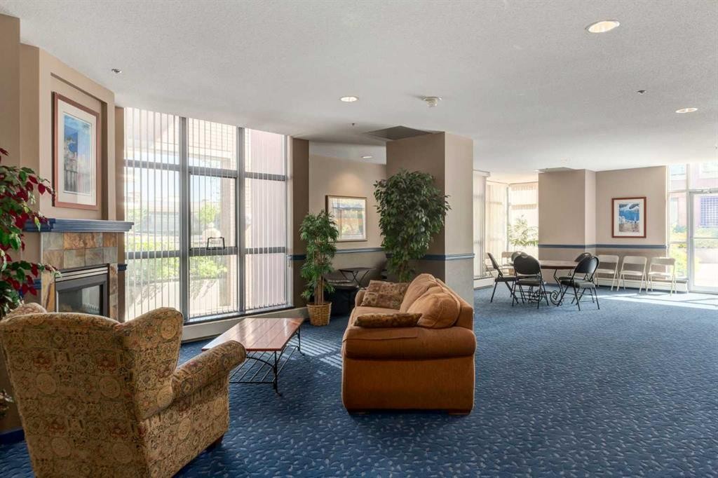 604-650 10 Street Sw, Calgary, AB - Indoor Photo Showing Living Room With Fireplace