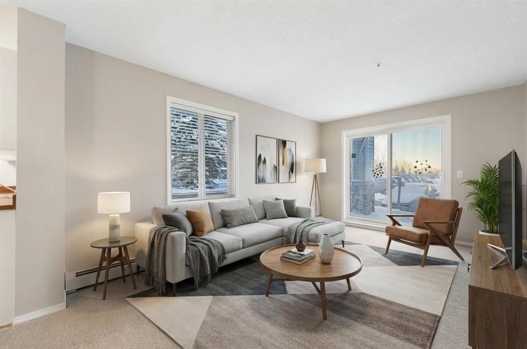 1102-2395 Eversyde Avenue Sw, Calgary, AB - Indoor Photo Showing Living Room