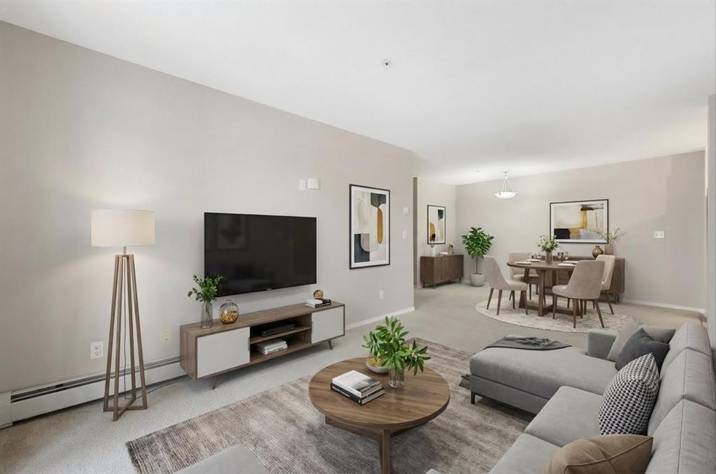 1102-2395 Eversyde Avenue Sw, Calgary, AB - Indoor Photo Showing Living Room