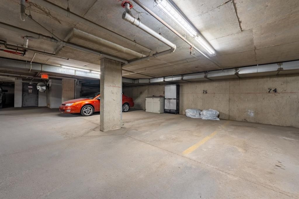 1102-2395 Eversyde Avenue Sw, Calgary, AB - Indoor Photo Showing Garage