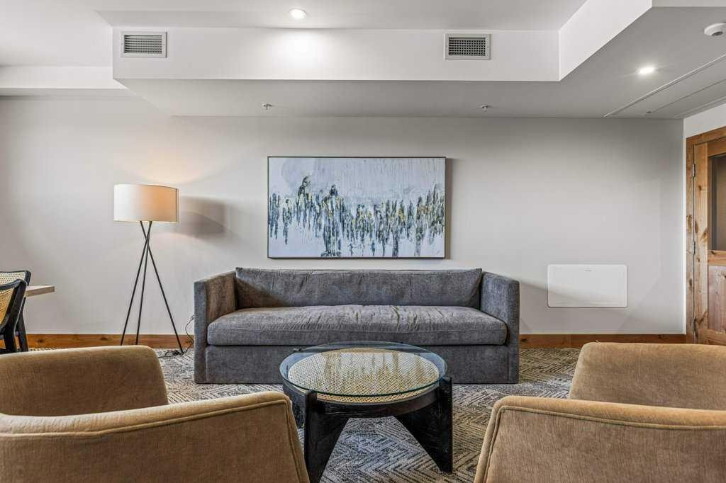 107-1315 Spring Creek Gate, Canmore, AB - Indoor Photo Showing Living Room