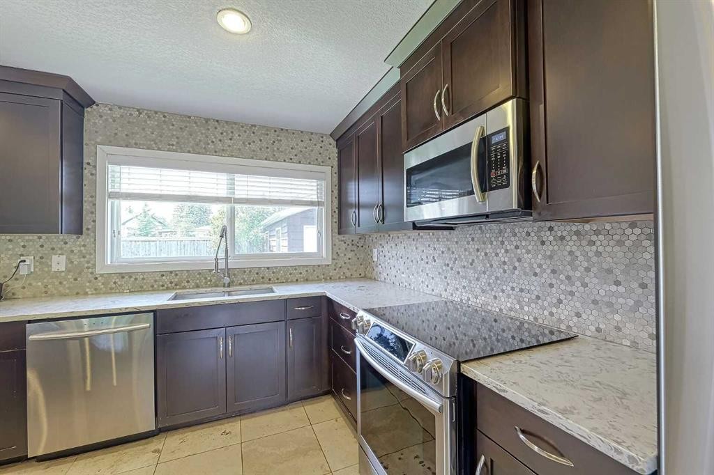 51 Hollyburn Road Sw, Calgary, AB - Indoor Photo Showing Kitchen With Upgraded Kitchen