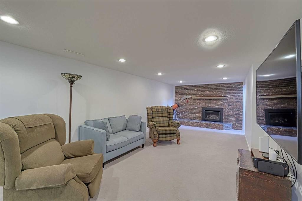 51 Hollyburn Road Sw, Calgary, AB - Indoor With Fireplace