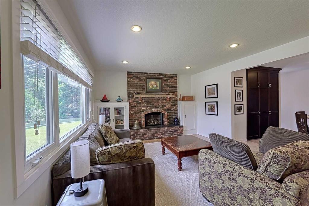 51 Hollyburn Road Sw, Calgary, AB - Indoor Photo Showing Living Room With Fireplace
