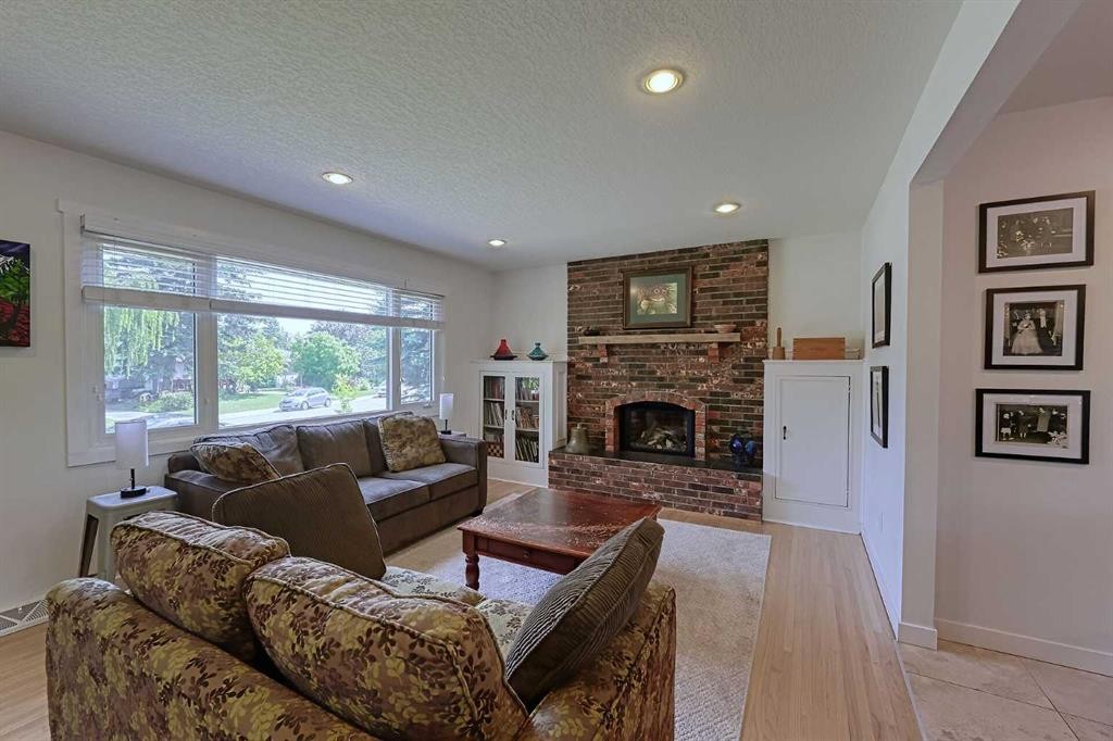 51 Hollyburn Road Sw, Calgary, AB - Indoor Photo Showing Living Room With Fireplace