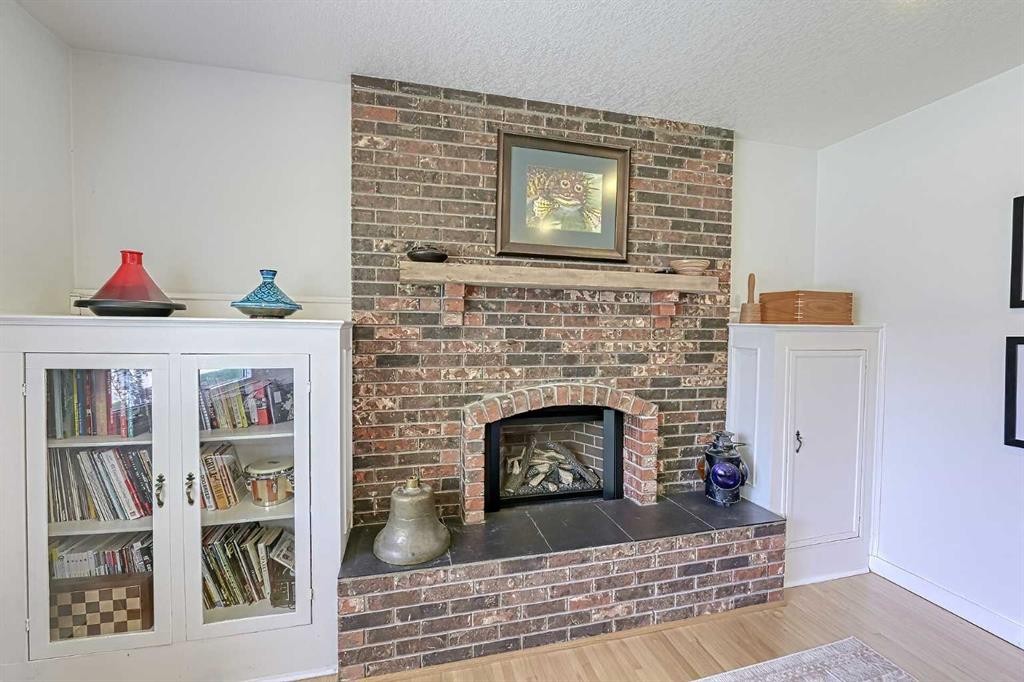 51 Hollyburn Road Sw, Calgary, AB - Indoor Photo Showing Living Room With Fireplace