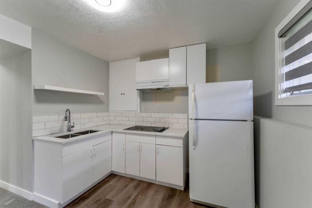 36 Whitehaven Road Ne, Calgary, AB - Indoor Photo Showing Kitchen With Double Sink