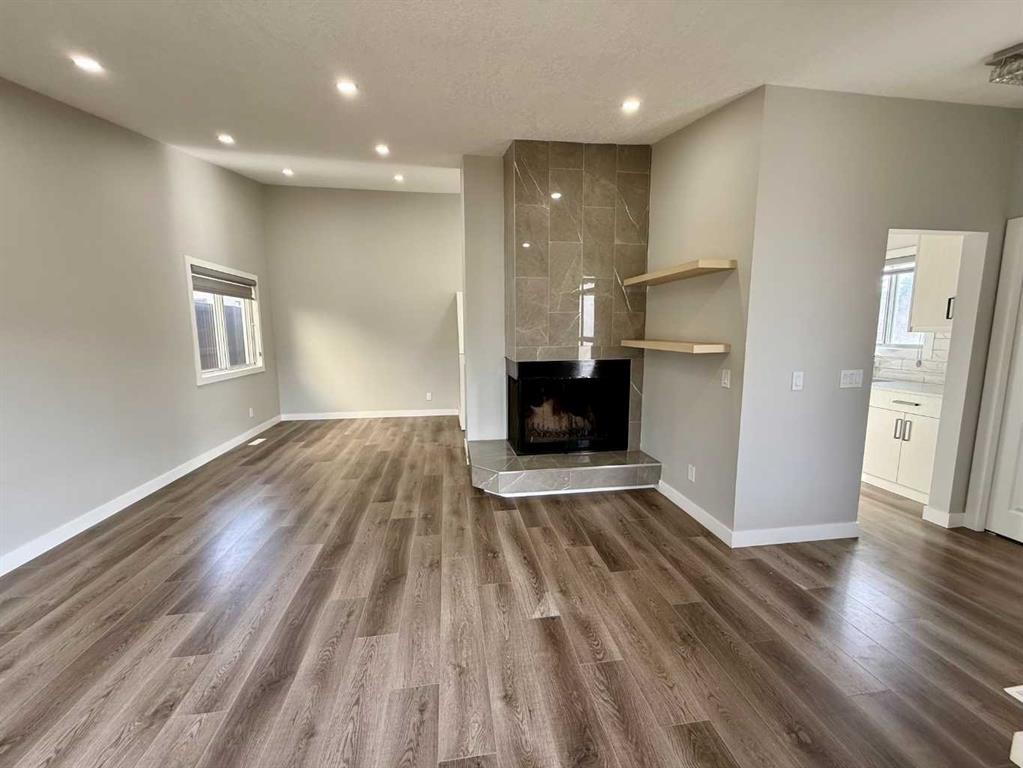 36 Whitehaven Road Ne, Calgary, AB - Indoor With Fireplace